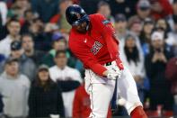 Boston Red Sox's Adam Duvall hits a two-run, walk-off home run in the ninth inning of a baseball game against the Baltimore Orioles, Saturday, April 1, 2023, in Boston. (AP Photo/Michael Dwyer)