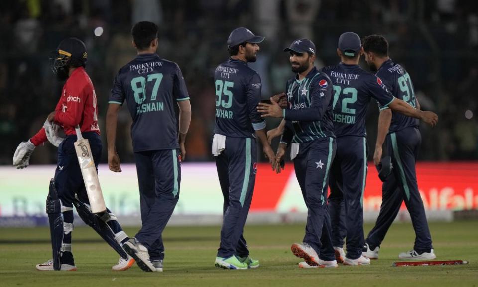 Pakistan players congratulate each other after winning the fourth T20 to level the series.