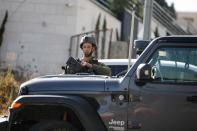 Israeli troops stand guard at the scene where three Palestinians who fired at Israeli forces were allegedly killed by Israeli troops, in Nablus