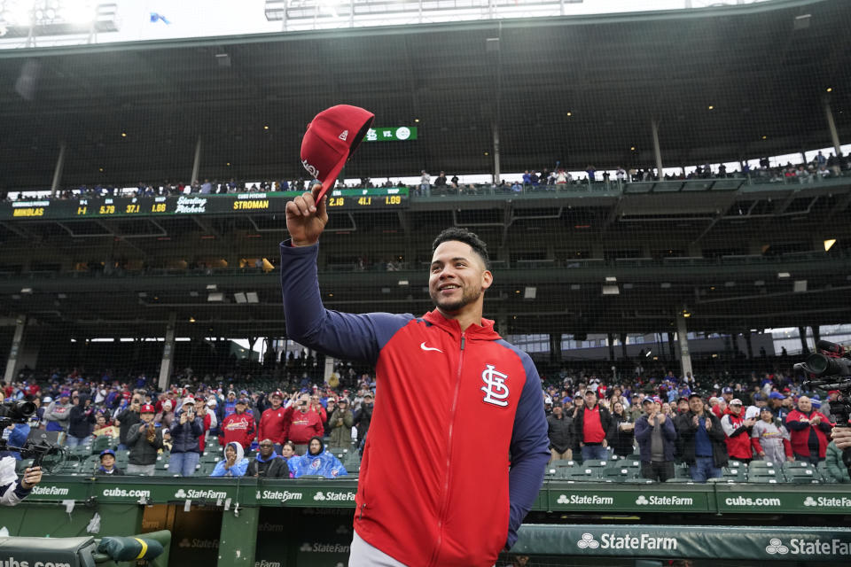 St. Louis Cardinals' Willson Contreras acknowledges the crowd's applause as the Chicago Cubs pay tribute to him before a baseball game Monday, May 8, 2023, in Chicago. Contreras returned to Wrigley Field for the first time since leaving the Cubs after last season. (AP Photo/Charles Rex Arbogast)
