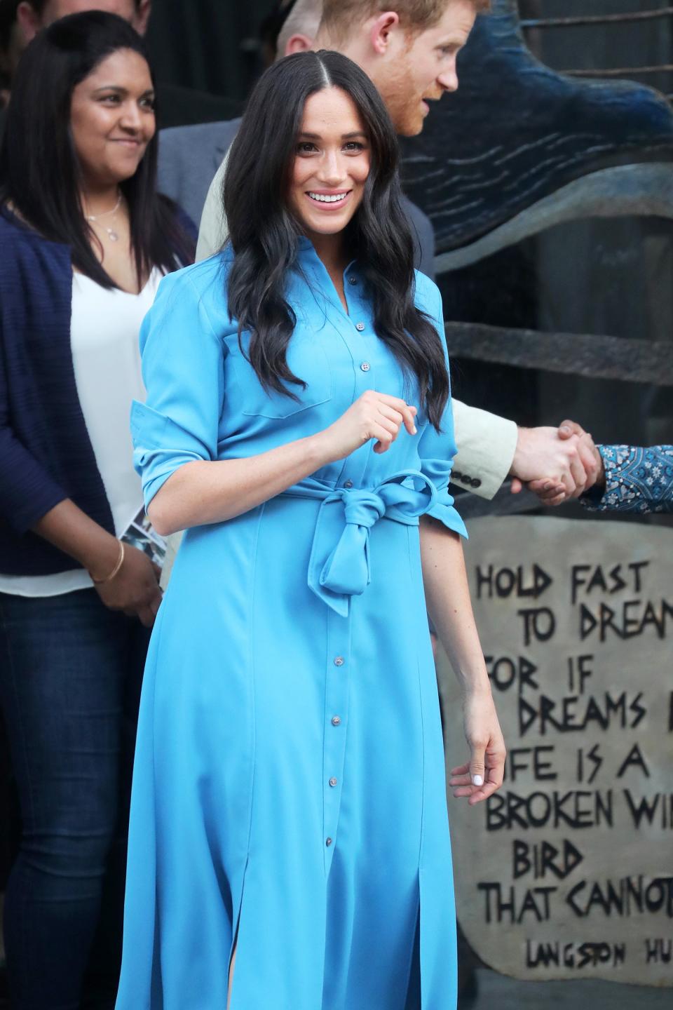 Meghan opted for a sky blue dress that she previously wore last year during the couple's visit to Tonga.