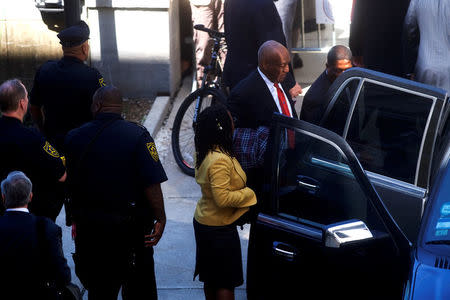 Bill Cosby departs the Montgomery County Courthouse with his publicist, Andrew Wyatt, after being found guilty on all counts in his sexual assault retrial, in Norristown, Pennsylvania, U.S., April 26, 2018. Mark Makela/Pool via Reuters