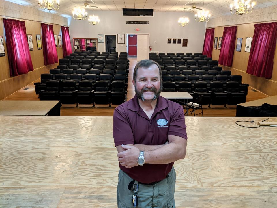 Barry Harbaugh, president of The Potomac Playmakers' board of directors, stands on stage in the theater at 17303 W. Washington St., near McDade and Hopewell roads. The community theater group acquired the building, the former Cedar Lawn Missionary Church, in 2017.