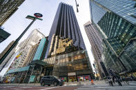 FILE - Pedestrians cross Fifth Avenue in front of Trump Tower, Wednesday, Feb. 17, 2021, in New York. The New York attorney general, Tuesday, Jan. 18, 2022, says her investigators have uncovered evidence that former President Donald Trump's company used "fraudulent or misleading" valuations of its golf clubs, skyscrapers and other property to get loans and tax benefits. (AP Photo/John Minchillo, File)