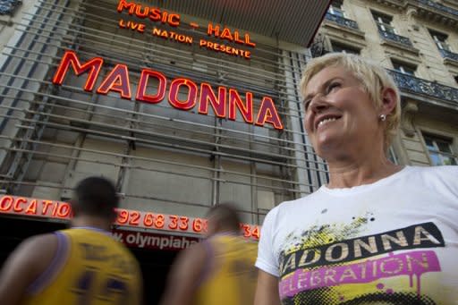 Fans of Madonna outside the Olympia concert hall in Paris wait for her show on Thursday. The singer was on the receiving end of an angry backlash from her fans on Friday for ending a Paris concert after just 45 minutes