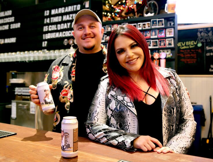 Jenni Rivera's children, Mike Rivera, left, and Jacquie Rivera, right, are launching La Chacalosa lager beer in honor of their mother, at Cerveza Cito Brewery, in Santa Ana on Tuesday, Dec. 13, 2022. The beer, with a limited initial batch of 15 barrels, was brewed at and will be released in cans and served on tap at the Santa Ana brewhouse.