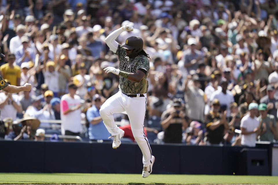 San Diego Padres' Josh Bell reacts after hitting a two-run home run during the sixth inning of a baseball game against the Washington Nationals, Sunday, Aug. 21, 2022, in San Diego. (AP Photo/Gregory Bull)