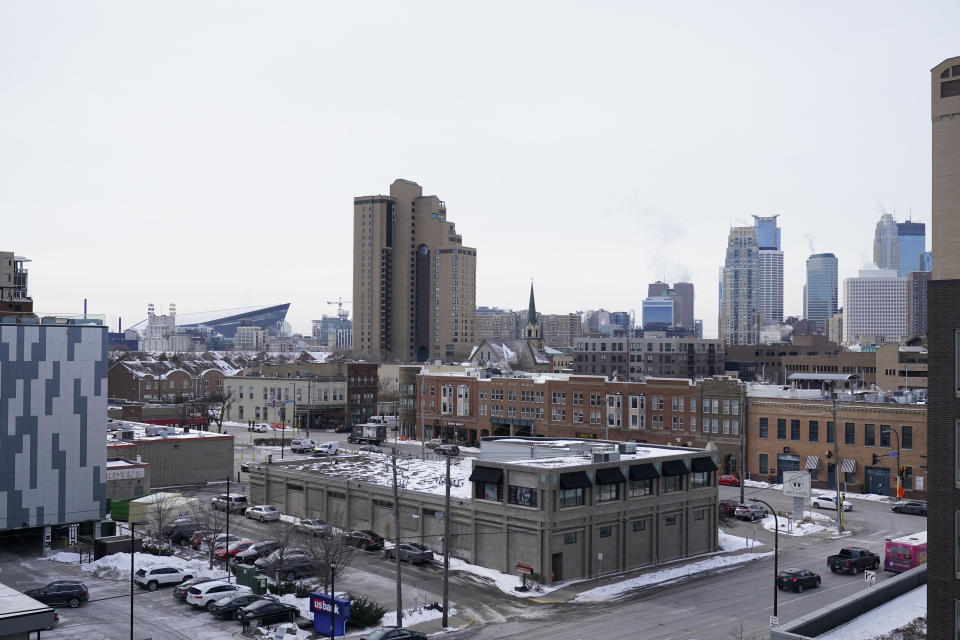 The Minneapolis skyline is viewed Tuesday, Feb. 21, 2023. A massive winter storm that will push across the northern U.S. in coming days could dump several feet of snow at higher elevations and bring dangerously cold temperatures, forecasters said Sunday. (AP Photo/Abbie Parr)