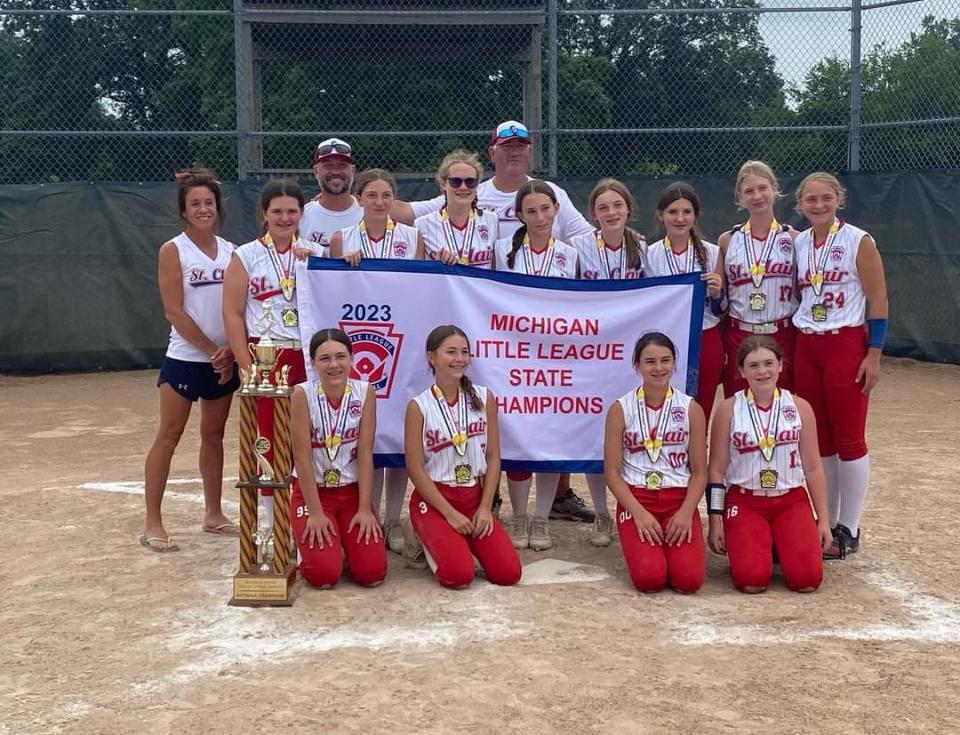 The St. Clair Little League softball team poses for a photo after beating Grosse Pointe, 2-1, to win the Michigan state championship in Jackson on Wednesday.