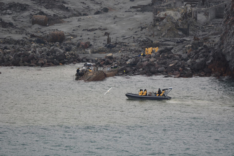 This photo released by the New Zealand Defence Force shows an operation to recover bodies from White Island after a volcanic eruption in Whakatane, New Zealand, Friday, Dec. 13, 2019. A team of eight New Zealand military specialists landed on White Island early Friday to retrieve the bodies of victims after the Dec. 9 eruption. (New Zealand Defence Force via AP)