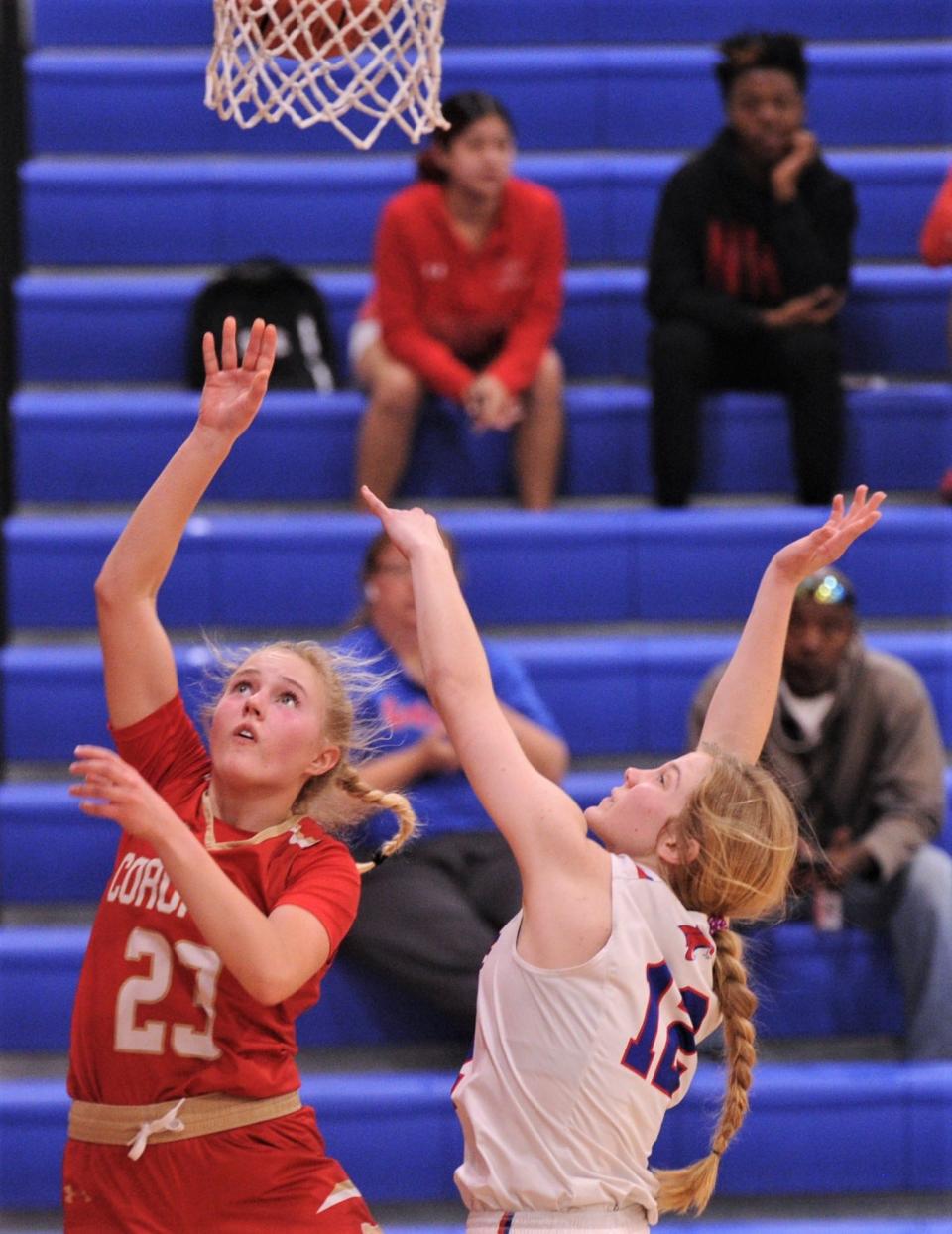 Lubbock Coronado's Trista Arnold (23) shoots over Cooper's Karrigan Parrott in the third quarter. Coronado beat the Lady Coogs 49-38 in the District 4-5A game Tuesday, Jan. 18, 2022, at Cougar Gym in Abilene.