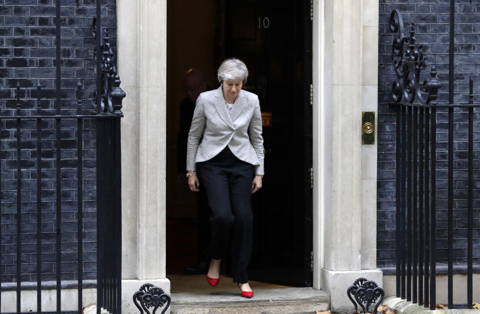 Britain's Prime Minister Theresa May arrives to make a statement outside 10 Downing Street, London, Thursday Nov. 22, 2018. Theresa May says Brexit deal's approval "is within our grasp" and she is determined to deliver it. (AP Photo/Kirsty Wigglesworth)