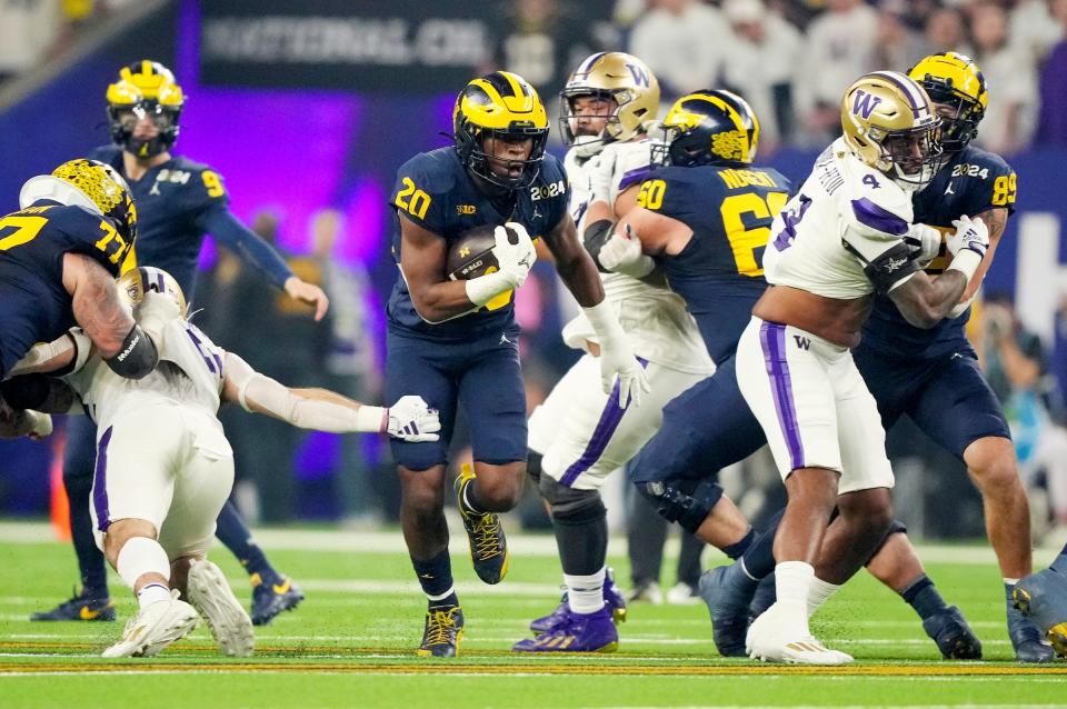 Michigan running back Kalel Mullings runs the ball during the first quarter of the College Football Playoff national championship game against Washington at NRG Stadium in Houston, Texas on Monday, Jan. 8, 2024.