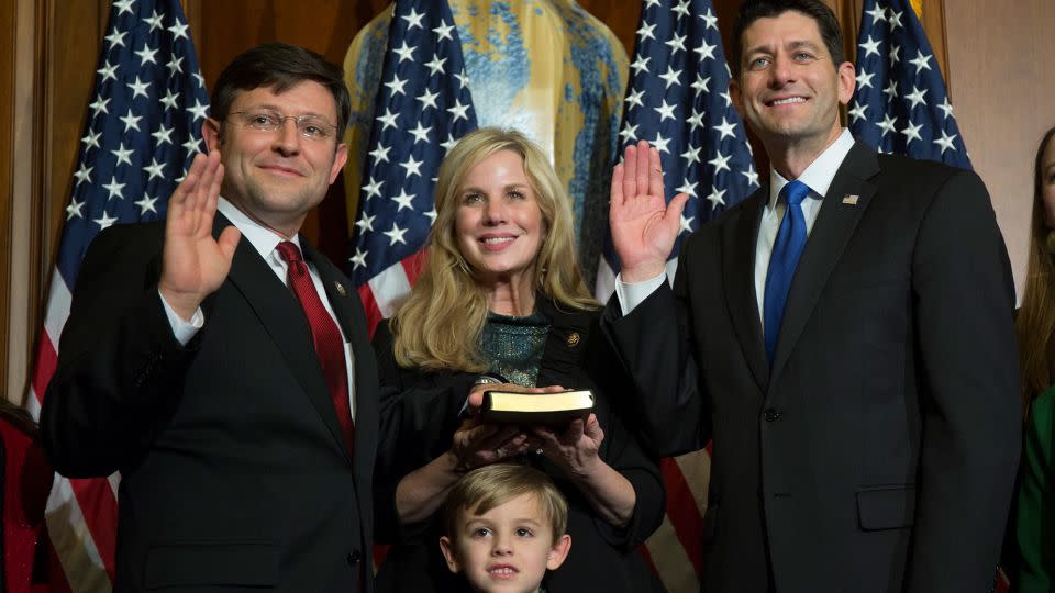 House Speaker Mike Johnson (left) and his wife Kelly attend a mock swearing in ceremony on Capitol Hill in 2017. The couple has what is called a "covenant marriage," a religiously influenced marriage option. - Zach Gibson/AP