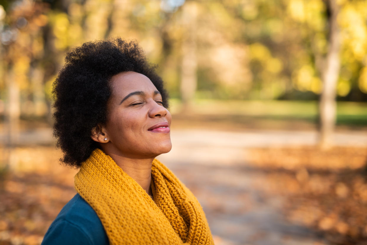 Woman enjoying the fall season