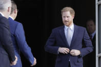 Britain's Prince Harry arrives at the gardens at Buckingham Palace in London, Thursday, Jan. 16, 2020. Prince Harry, the Duke of Sussex will host the Rugby League World Cup 2021 draw at Buckingham Palace, prior to the draw, The Duke met with representatives from all 21 nations taking part in the tournament, as well as watching children from a local school play rugby league in the Buckingham Palace gardens. (AP Photo/Kirsty Wigglesworth)