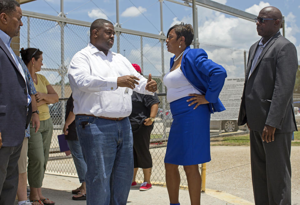 FILE - State Rep. C. Denise Marcelle, center right, D-Baton Rouge, talks to Al Perkins, center left, deputy general counsel for the National Bar Association, in front of the Baton Rouge jail about the procedure for the release of Black Lives Matter activist DeRay McKesson in Baton Rouge, La., on Sunday, July 10, 2016. In 2022, Marcelle served on a special committee looking into reports that Gov. John Bel Edwards privately knew much more about Black motorist Ronald Greene’s deadly encounter with state troopers than he publicly let on. “We uncovered a lot of things the general public did not know, but there needs to be some accountability. ... I think there was a cover-up, and the question becomes who is going to look at this any further.” (AP Photo/Max Becherer, File)