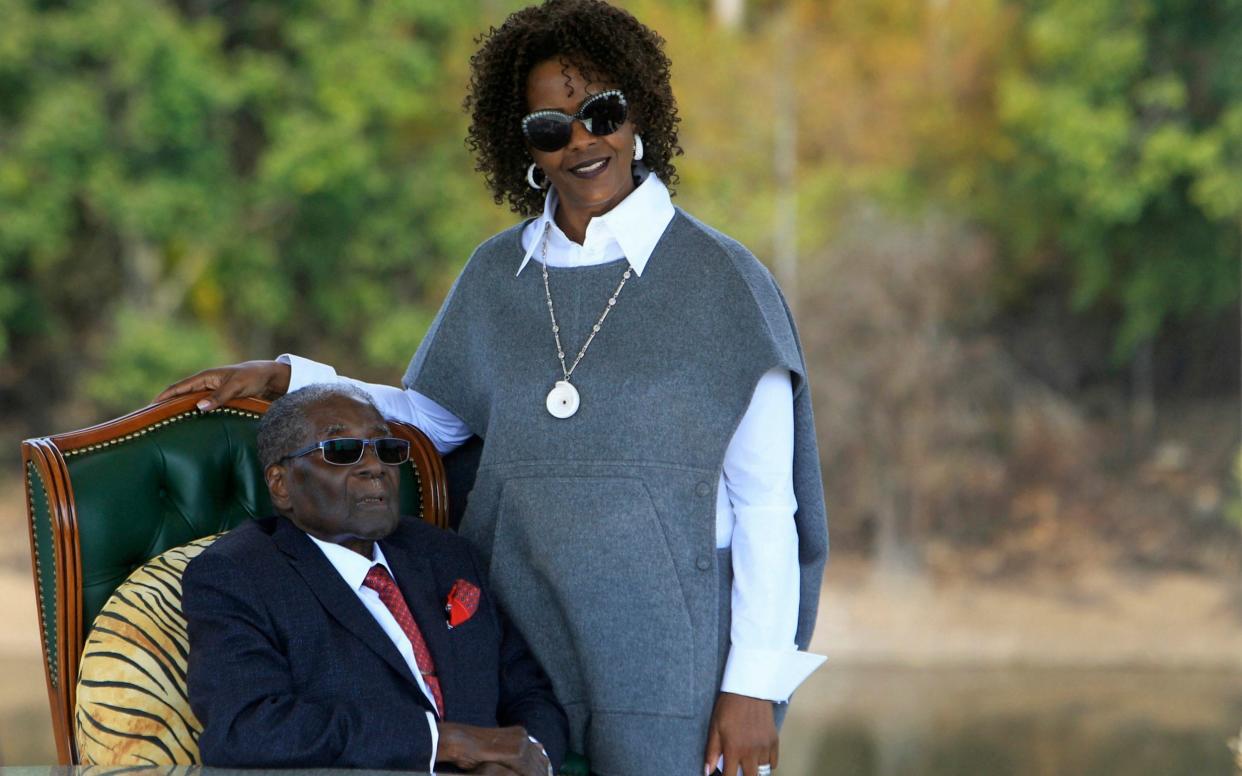 Robert Mugabe and his wife Grace, pictured in 2018  - AP