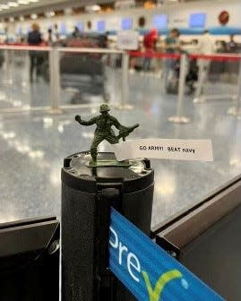 An infantryman deployed by an Army fan at Tampa International Airport in 2022 ahead of the Army-Navy game.