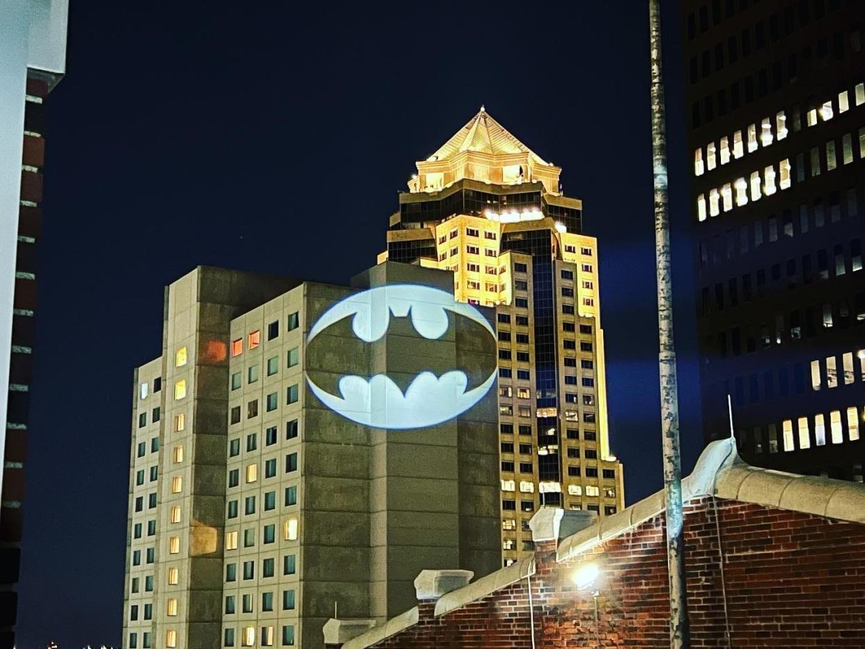 The Bat Signal is flashed on the Marriott in downtown Des Moines on May 15, 2022. The Iowa League of Heroes held a photo shoot on top of the Equitable Building for an upcoming Batman event.