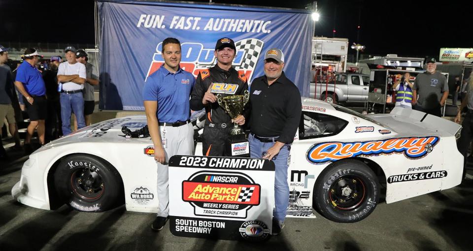 Sentara Health Late Model Stock Car Division Champion Carter Langley of Zebulon, North Carolina (center) is congratulated in Victory Lane by South Boston Speedway General Manager Chase Brashears (left) and Pocono Raceway and South Boston Speedway CEO Nick Igdalsky following his win in the 150-lap Sentara Health Late Model Stock Car Division race at South Boston Speedway on Sept. 2, 2023. (Joe Chandler/South Boston Speedway)