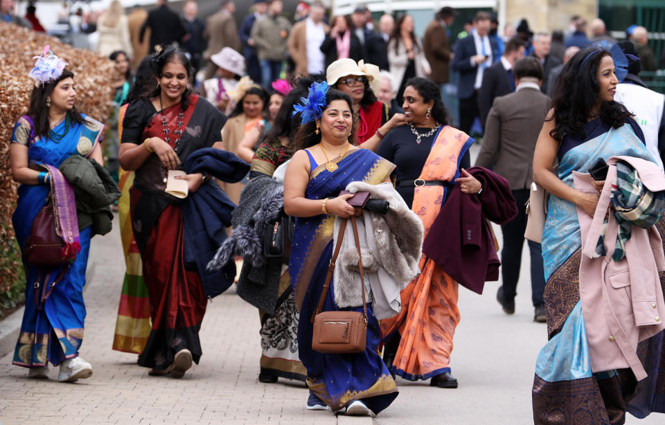 CHELTENHAM, ENGLAND - MARCH 13: Racegoers arrive ahead of day two of the Cheltenham Festival 2024 at Cheltenham Racecourse on March 13, 2024 in Cheltenham, England. (Photo by Michael Steele/Getty Images)