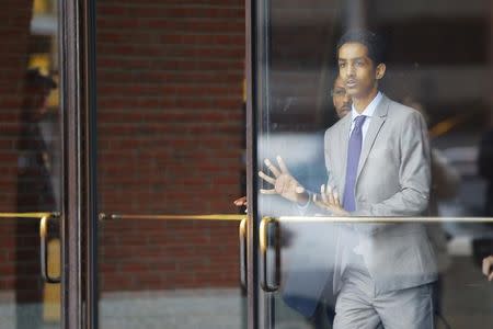 Robel Phillipos, a friend of suspected Boston Marathon bomber Dzhokhar Tsarnaev, who is charged with lying to investigators, leaves the federal courthouse after a hearing in his case in Boston, Massachusetts May 13, 2014. REUTERS/Brian Snyder/Files