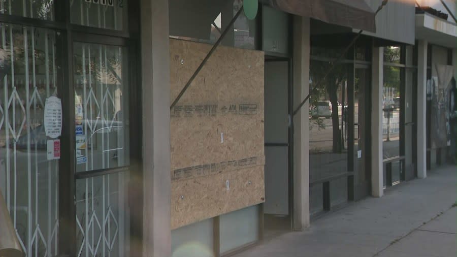 The boarded-up window of Bead Boutique on July 24, 2024. (KTLA)