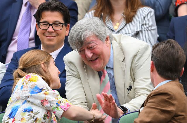 <p>Karwai Tang/WireImage</p> (Back row from left) Michael McIntyre and Stephen Fry chat with (front row from left) Princess Beatrice and Edoardo Mapelli Mozzi at Wimbledon on July 9, 2024