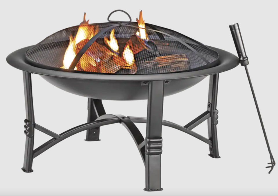 For Living Augusta Round Wood Burning Outdoor Fire Bowl/Fire Pit w/ Fireplace Poker, 29.5 x 19-in (Photo via Canadian Tire)