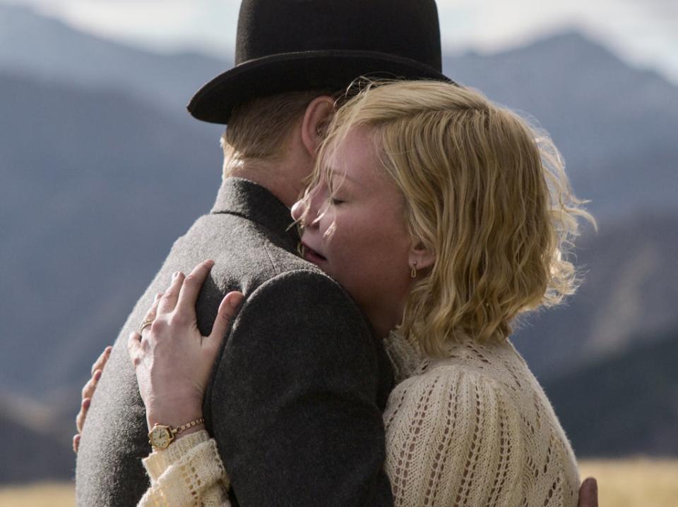 Rose (Dunst) embraces George Burbank, played by real-life husband Jesse Plemons, in ‘The Power of the Dog’ (Netflix)