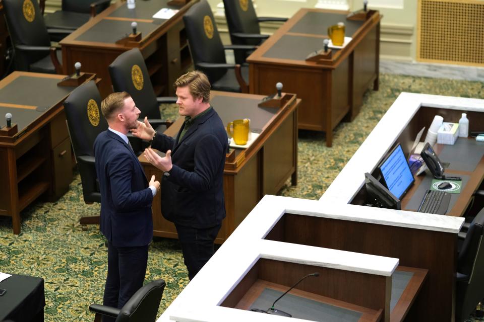 Rep. Forrest Bennett, right, asks state schools Superintendent Ryan Walters a question on the floor during a hearing Tuesday at the state Capitol.