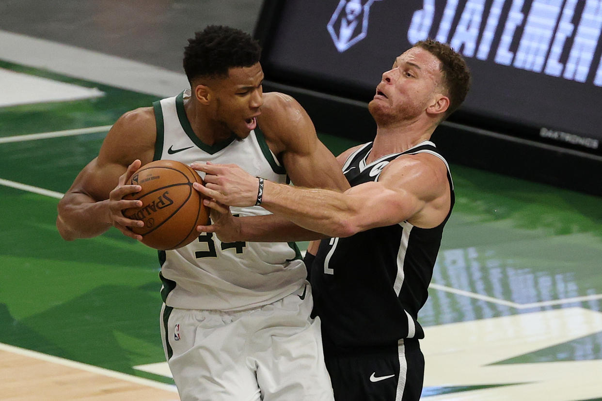 Giannis Antetokounmpo (left) flexed his muscle against the Brooklyn Nets. (Stacy Revere/Getty Images)
