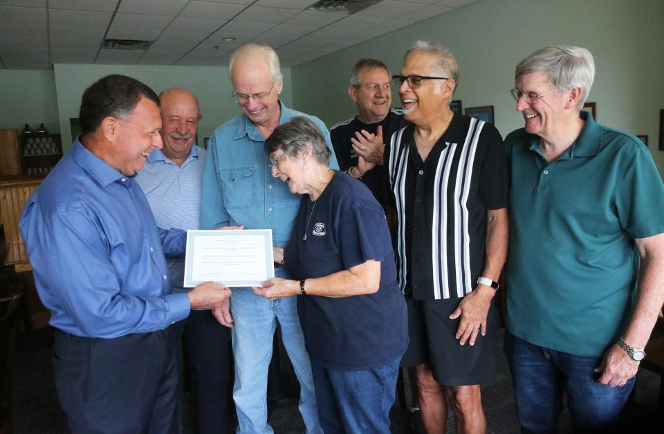 Norma Clark, owner of Norma's Restaurant in York is honored by the Committee for Veterans' Affairs of York for her support of veterans. From left are Chairman Don LeFante, Brent Mohr, Michael Dow, Norma Collins, Tom Coffey, Lew DiTommaso, and Wade Fox.
