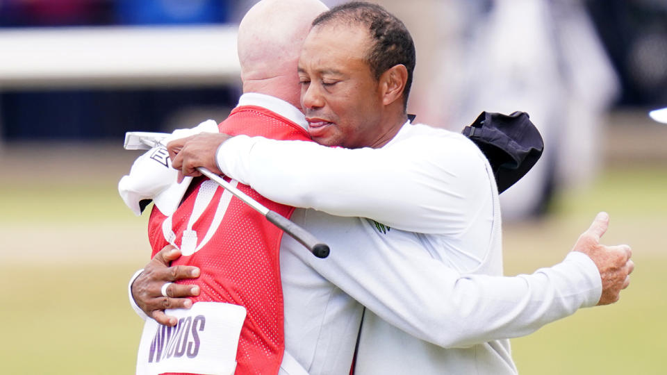 Tiger Woods is pictured embracing his caddie after missing the cut at the 2022 British Open.