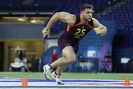 FILE PHOTO: Mar 3, 2019; Indianapolis, IN, USA; Ohio State defensive lineman Nick Bosa (DL25) goes through workout drills during the 2019 NFL Combine at Lucas Oil Stadium. Mandatory Credit: Brian Spurlock-USA TODAY Sports