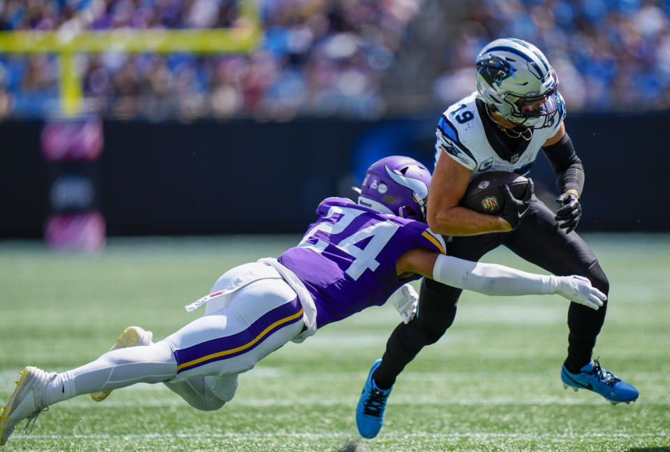 Carolina Panthers wide receiver Adam Thielen is tackled by Minnesota Vikings safety Camryn Bynum during the first half of an NFL football game Sunday, Oct. 1, 2023, in Charlotte, N.C. (AP Photo/Jacob Kupferman)