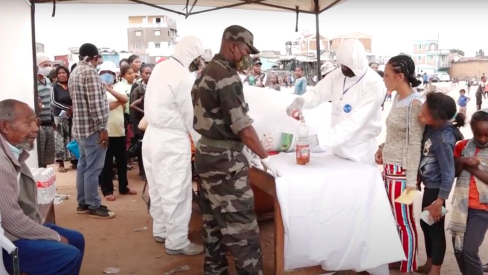 The bottle of herbal tea were given out free to the vulnerable. (YouTube/AFP)