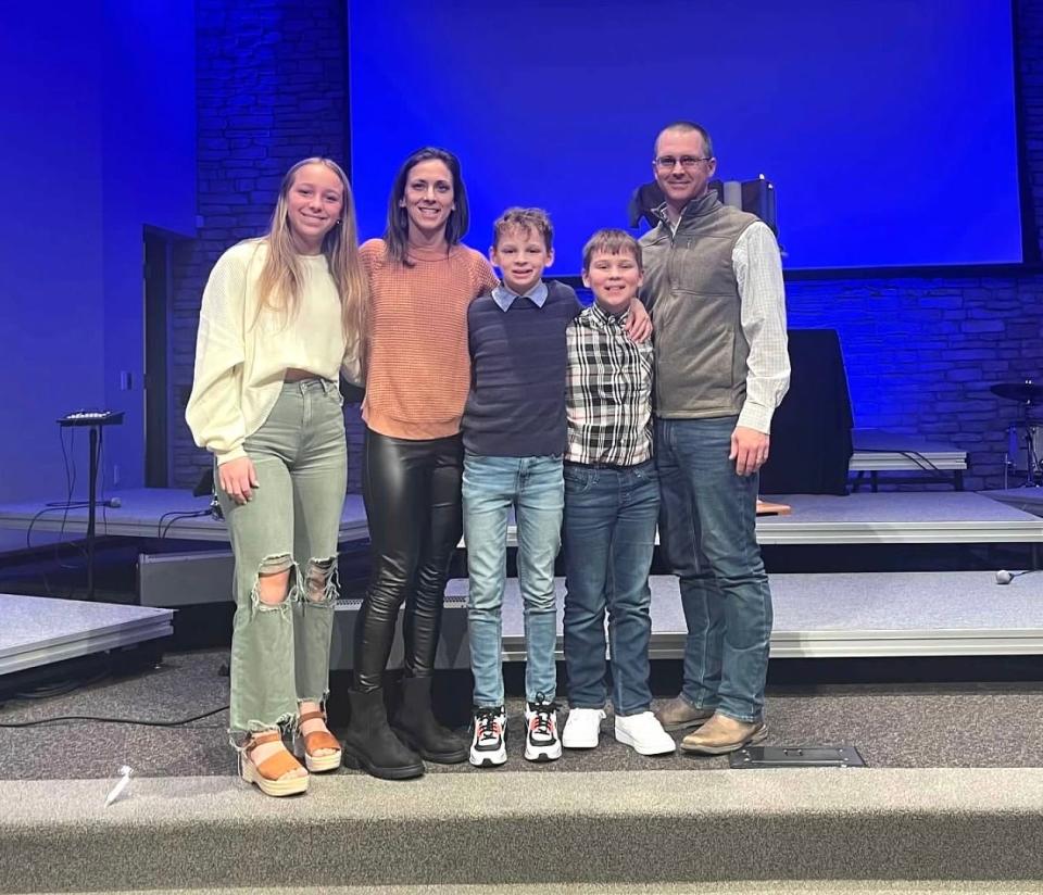 Karen Mathes, second from left, and Jason Mathes, far right, of Polk City, sought IVF treatment in 2009 and 2011 to have their daughter, Nora, and their twin sons Camden and Gavin.