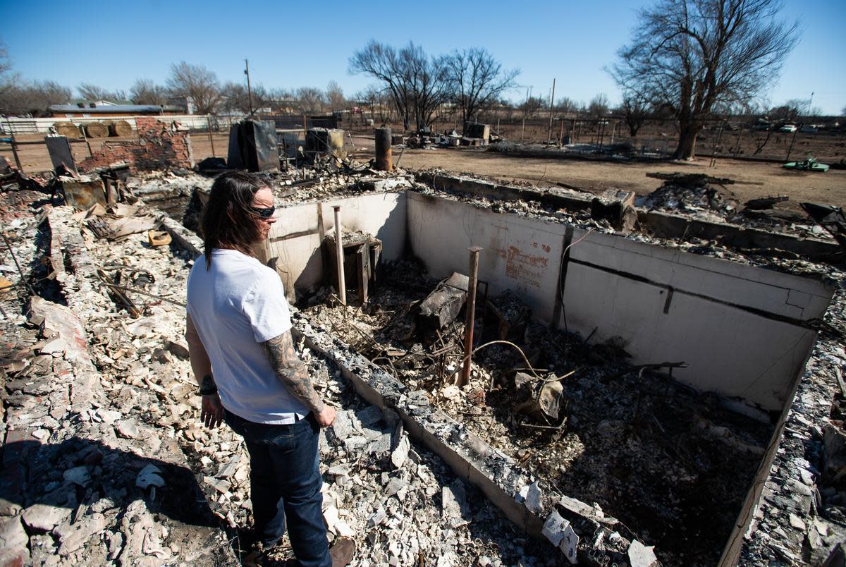 Scott McBroom looks at the rubble of his burned house Friday, March. 1, 2024, in Fritch, Texas.