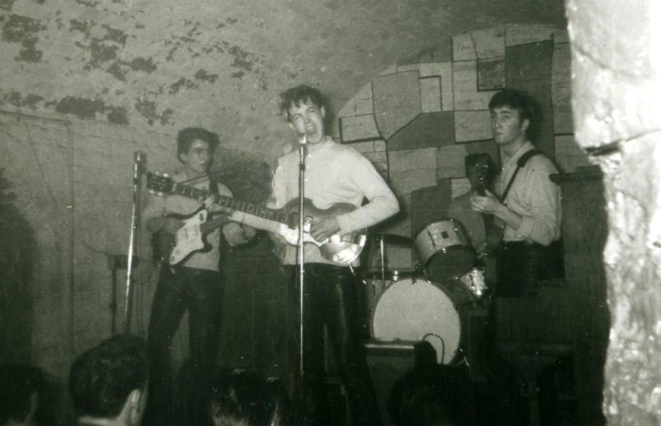 The Beatles playing the Cavern Club in 1961 (PA)