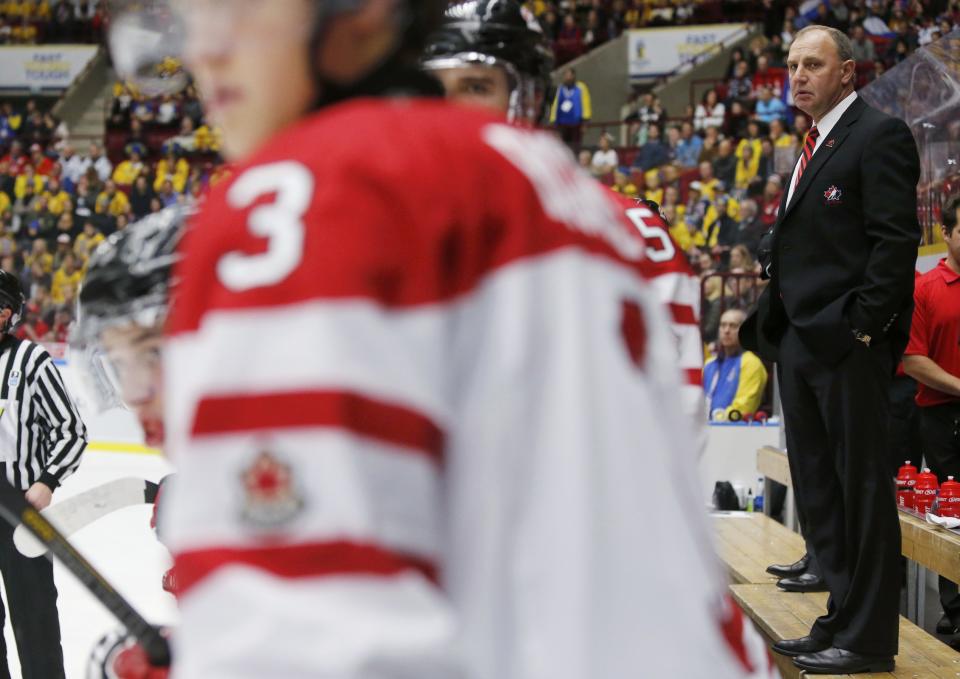 Canada's head coach Brent Sutter looks on as his team plays Russia during the second period of their IIHF World Junior Championship ice hockey game in Malmo, Sweden, January 5, 2014. REUTERS/Alexander Demianchuk (SWEDEN - Tags: SPORT ICE HOCKEY)