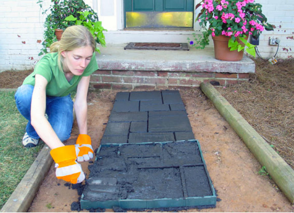 <body> <p>Consider your patio floor and walkway a blank canvas. Update it this summer with custom concrete pavers you make yourself. Choose different sized and shaped objects for molds to vary your design. Add color with stain or paint for <a rel="nofollow noopener" href=" http://www.bobvila.com/pink-kitchen/46922-awesome-accents-17-ways-to-make-any-space-pop-with-color/slideshows#.VUfo0tpViko?bv=yahoo" target="_blank" data-ylk="slk:extra visual pop;elm:context_link;itc:0;sec:content-canvas" class="link ">extra visual pop</a>. No matter how big or small, it can be your happy place.</p> <p><strong>Related: <a rel="nofollow noopener" href=" http://www.bobvila.com/75-years-of-durability-and-versatility/48771-10-ways-to-go-crazy-for-concrete/slideshows#.VUfpFtpViko?bv=yahoo" target="_blank" data-ylk="slk:10 Ways to Go Crazy for Concrete;elm:context_link;itc:0;sec:content-canvas" class="link ">10 Ways to Go Crazy for Concrete</a> </strong> </p> </body>