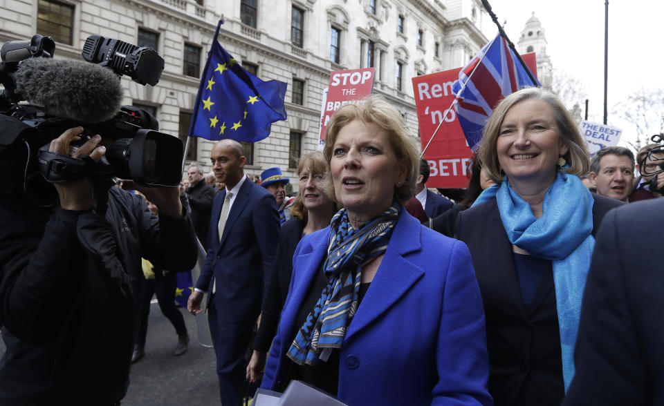 CAPTION CORRECTS NAME SPELLING - British politicians Anna Soubry, left, and Sarah Wollaston arrive for a press conference in Westminster in London, Wednesday, Feb. 20, 2019. Cracks in Britain's political party system yawned wider Wednesday, as three pro-European lawmakers - Soubry, Allen and Wollaston - quit the governing Conservatives to join a newly formed centrist group of independents who are opposed to the government's plan for Britain's departure from the European Union.(AP Photo/Kirsty Wigglesworth)