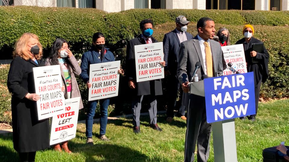 Reggie Weaver, at podium, speaks outside the Legislative Building in Raleigh, North Carolina, Feb. 15, 2022, about a partisan gerrymandering ruling by the North Carolina Supreme Court.  - Gary D. Robertson/AP