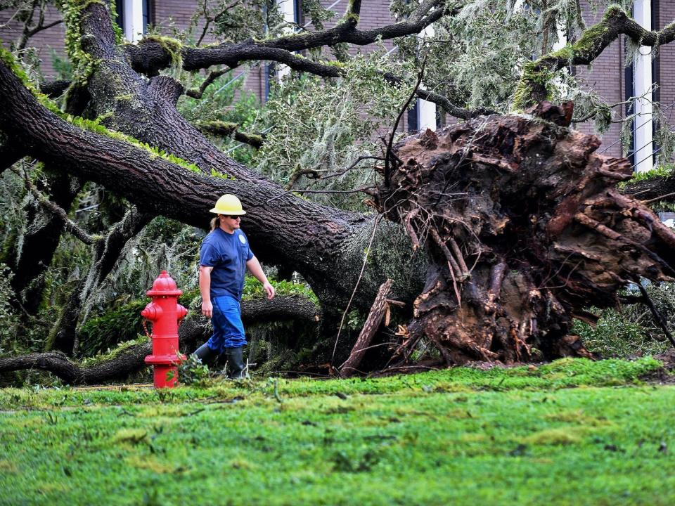 A worker repairs energy lines during a power outage after Hurricane Ian passed through the area on September 29, 2022 in Bartow, Florida. The hurricane brought high winds, storm surge and rain to the area causing severe damage.