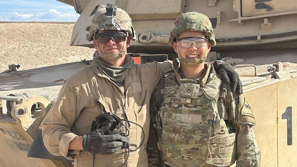 Pfc. Richard Zheng, a paralegal assigned to 4th Battalion, 6th Infantry Regiment, stands with Sgt. Logan McCormick, a tank commander in Commanche Company, 4th Battalion, 6th Infantry Regiment, beside his tank at Range 88 on Fort Bliss, Texas, Oct. 23, 2023. Zheng fired a round from McCormick’s tank as a request for winning the title of 2023 Fort Bliss Paralegal of the Year. (1st Armored Division/X)