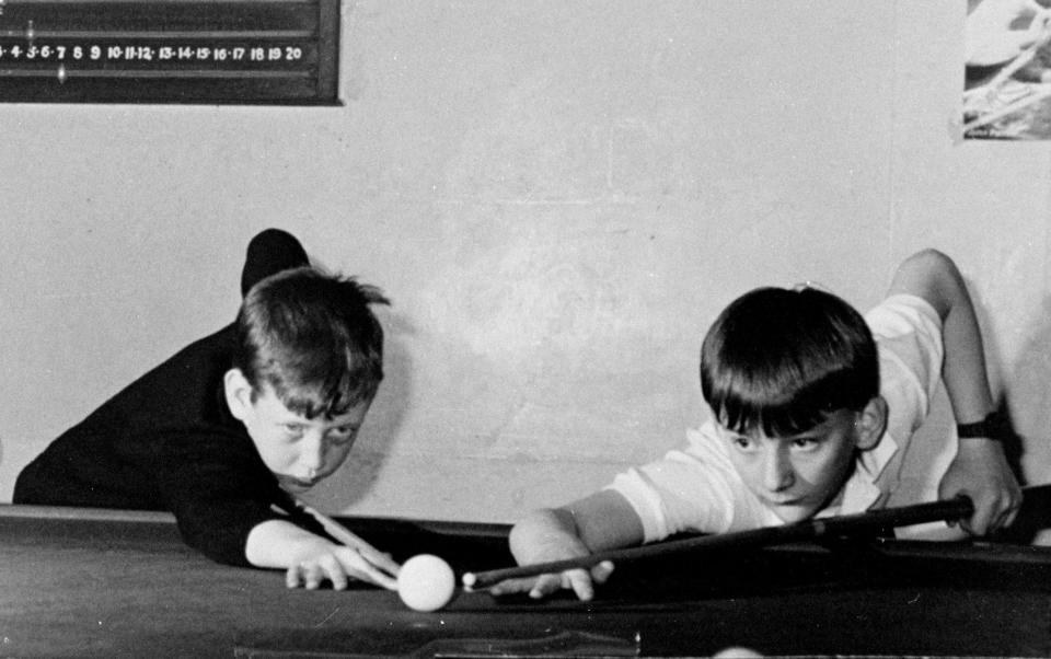 Snooker champion Mark Williams playing with a friend at his local poolhall when he was younger - Dragon News Picture Agency