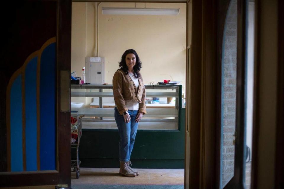 Darla Saylor-Jackson poses for a portrait near the concession area at the historic Novo Theater building in downtown Cumberland, Ky., on Friday, March 31, 2023. Saylor-Jackson is restoring the theater.