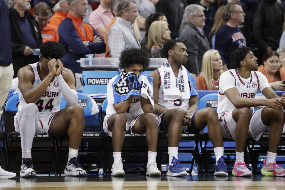 Auburn players sit on the bench react toward the end of the second half of a first-round college basketball game against Yale in the NCAA Tournament in Spokane, Wash., Friday, March 22, 2024. (AP Photo/Young Kwak)